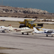 Stranded aircraft with the destroyed runway in the background.
